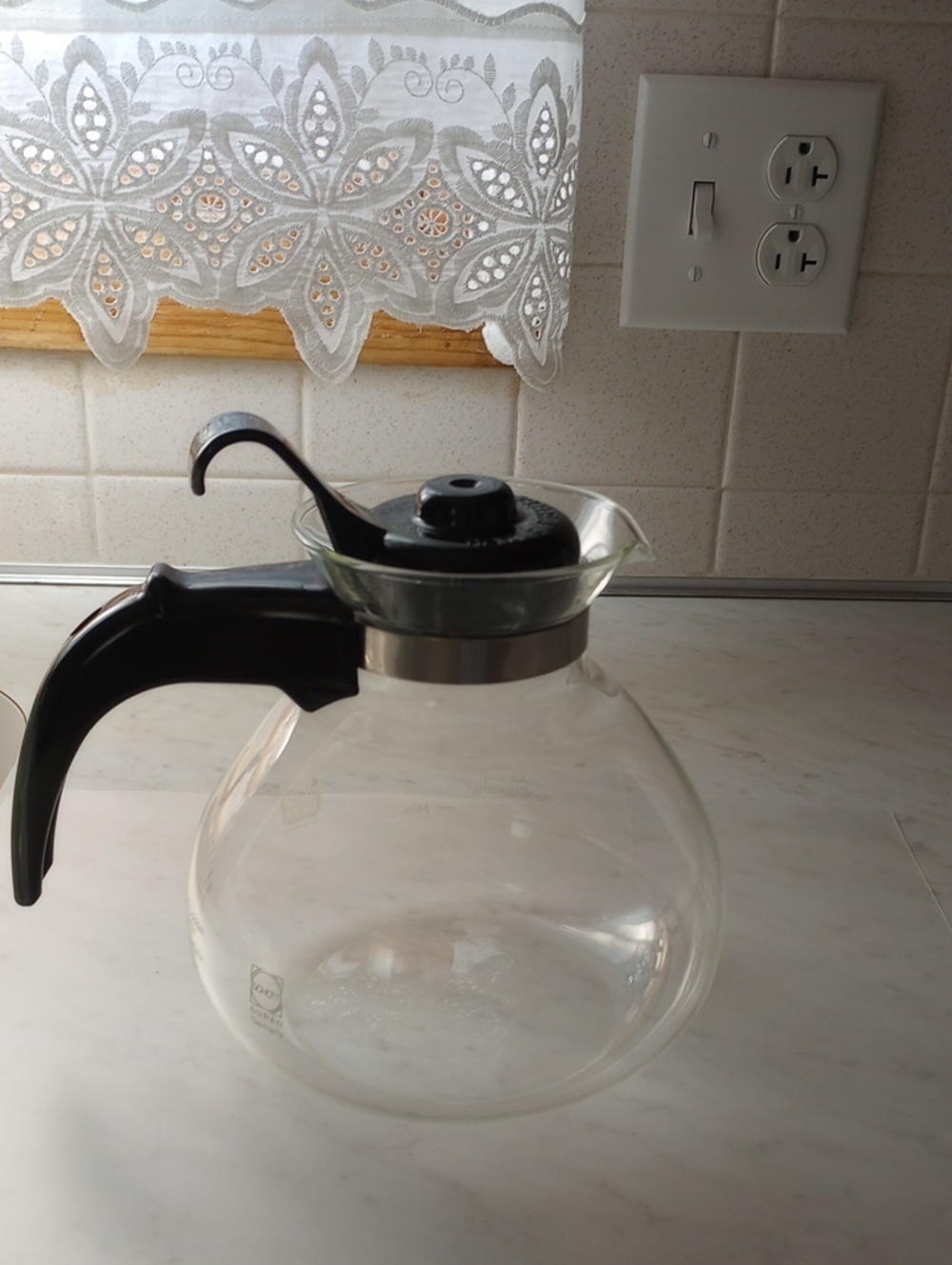 Clear Glass Coffee Carafe with Black Handle and Lid.   SCHOTT